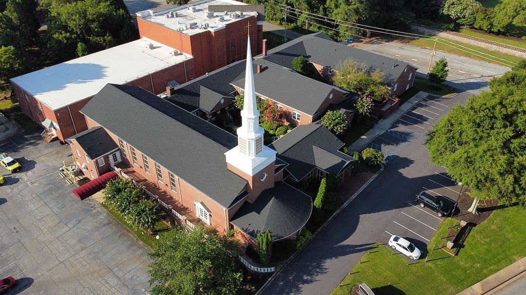 An aerial overhead view of a community building with new roofing.