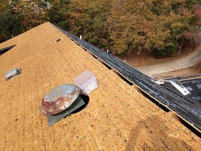 A new roof is installed by Cornerstone Construction.